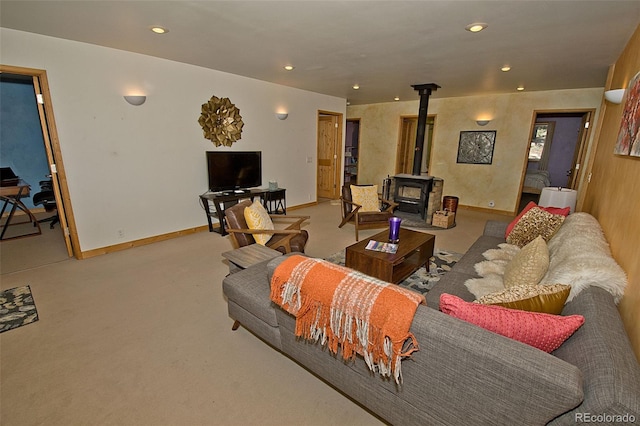 carpeted living room featuring a wood stove