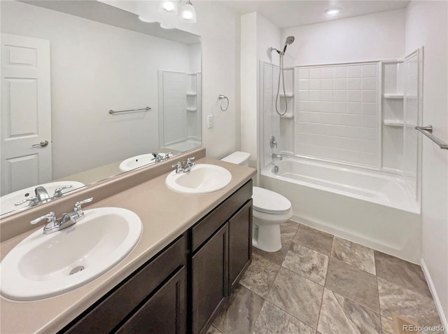 bathroom featuring washtub / shower combination, a sink, and toilet