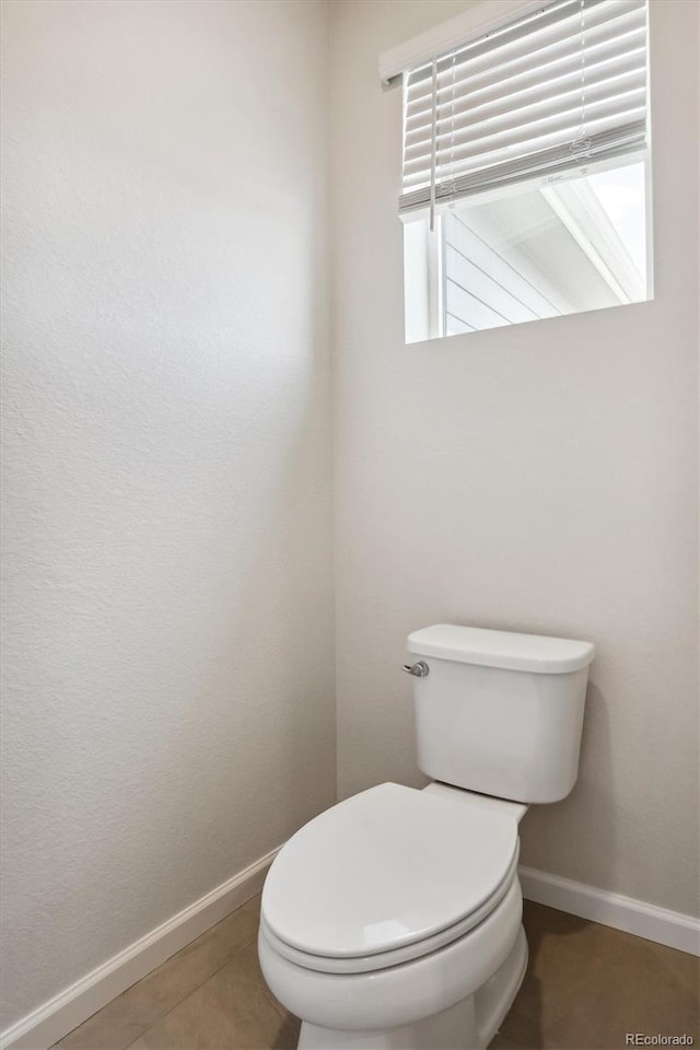 14135 Deertrack Ln, Parker, CO 80134 - bathroom with baseboards, toilet, and tile patterned flooring
