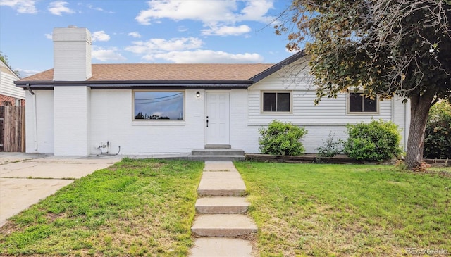 7952 Zuni St, Denver, CO 80221 - ranch-style house with a chimney, roof with shingles, and brick siding
