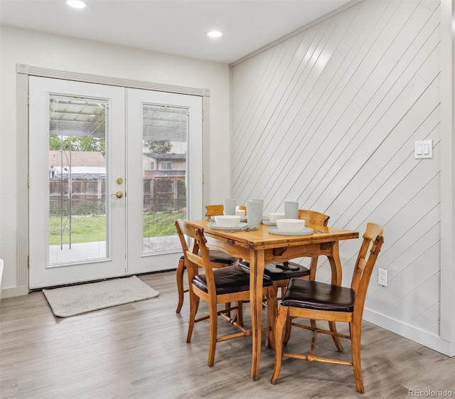 7952 Zuni St, Denver, CO 80221 - dining room with french doors, light wood finished floors, baseboards, and recessed lighting