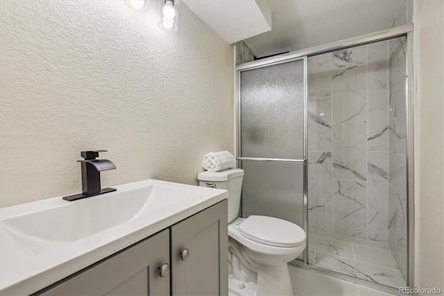 7952 Zuni St, Denver, CO 80221 - bathroom with marble look tile flooring, a textured wall, a marble finish shower, toilet, and vanity