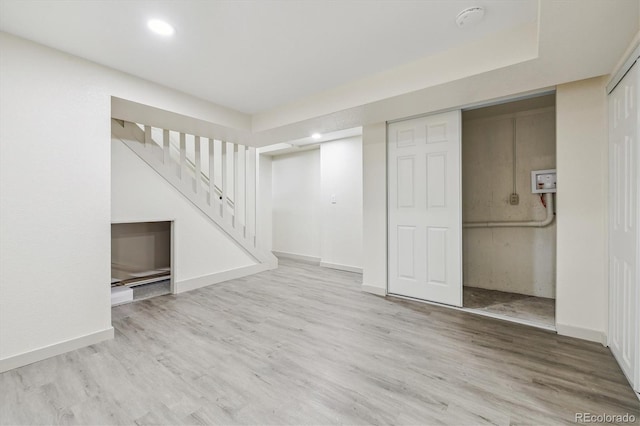 7952 Zuni St, Denver, CO 80221 - finished basement with stairs, wood finished floors, baseboards, and recessed lighting