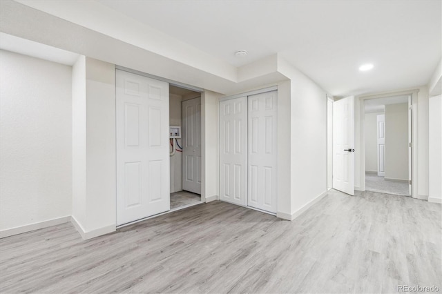 7952 Zuni St, Denver, CO 80221 - finished basement with light wood-style floors and baseboards