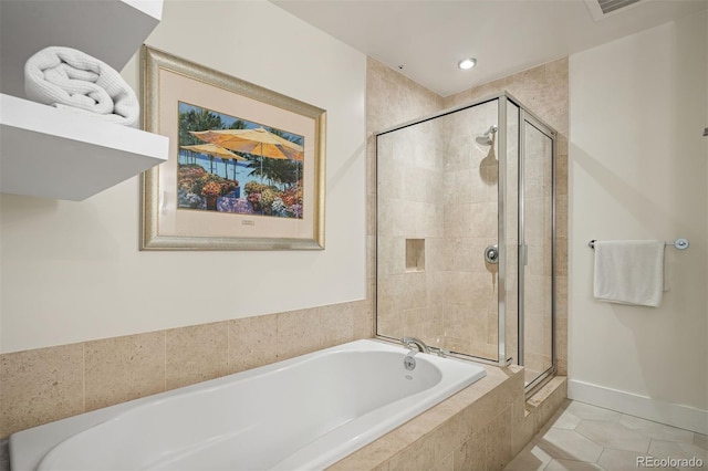 bathroom featuring tile patterned flooring and plus walk in shower