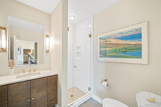 bathroom with vanity, a shower with door, and toilet