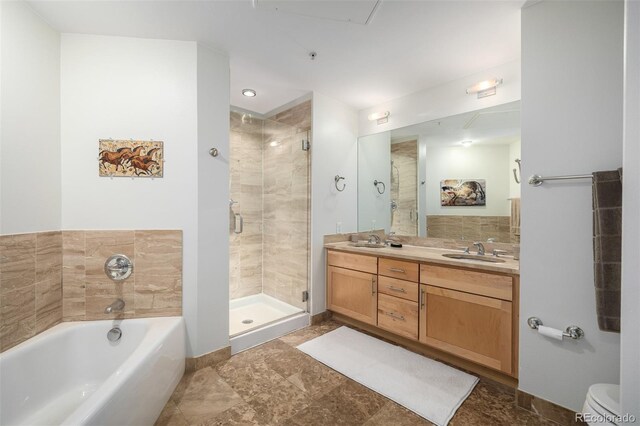 bathroom featuring plus walk in shower and vanity