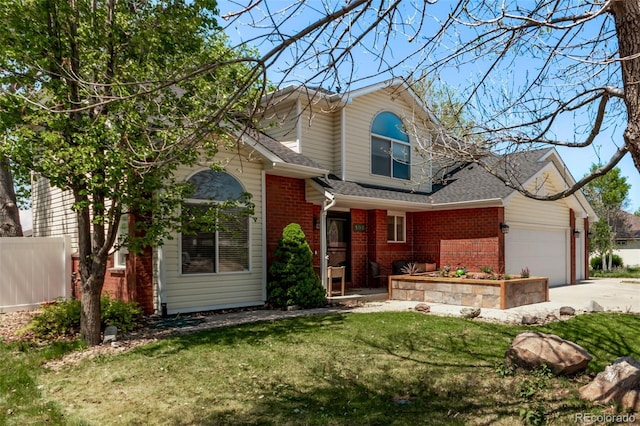 105 Hawthorn St, Frederick, CO 80530 - traditional-style house with brick siding, an attached garage, driveway, and roof with shingles