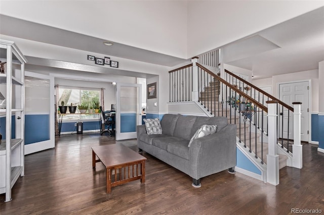 105 Hawthorn St, Frederick, CO 80530 - living room featuring stairs, wood finished floors, a desk, and baseboards