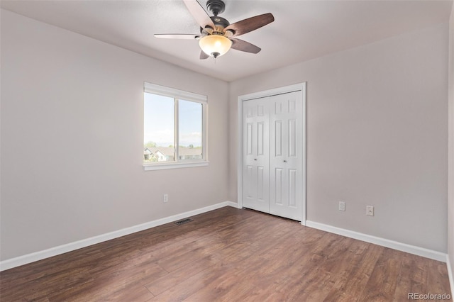 105 Hawthorn St, Frederick, CO 80530 - unfurnished bedroom featuring baseboards, dark wood-style flooring, a closet, and ceiling fan