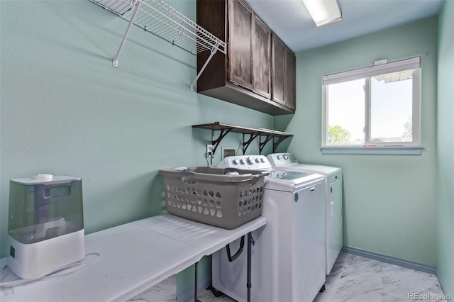 105 Hawthorn St, Frederick, CO 80530 - washroom featuring cabinet space, light marble finish floors, and independent washer and dryer