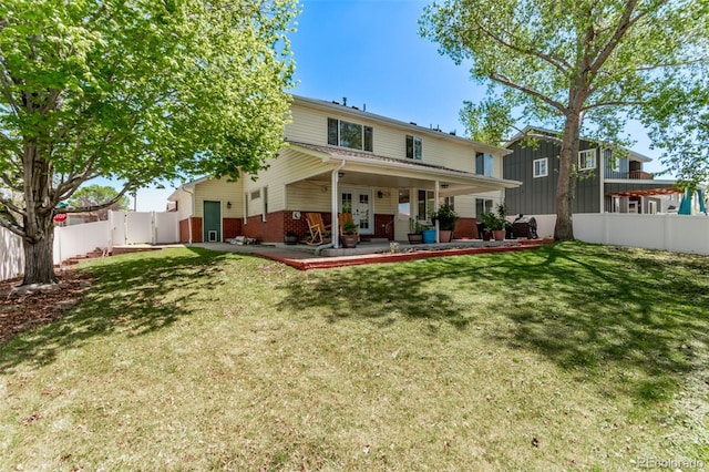 105 Hawthorn St, Frederick, CO 80530 - back of house featuring brick siding, french doors, and a patio area