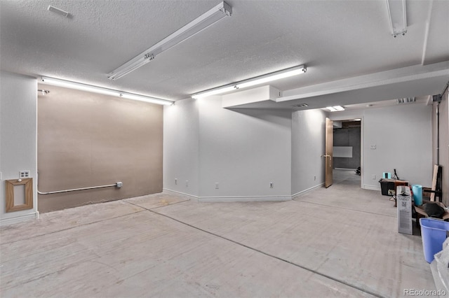 105 Hawthorn St, Frederick, CO 80530 - below grade area with a textured ceiling and baseboards