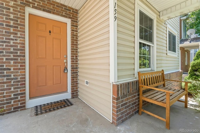 property entrance featuring a porch