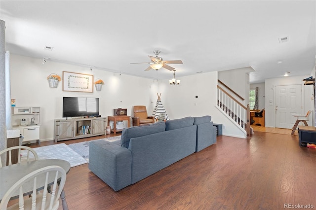 living room with ceiling fan and dark hardwood / wood-style floors