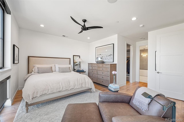 bedroom featuring recessed lighting, visible vents, a spacious closet, ceiling fan, and light wood-type flooring