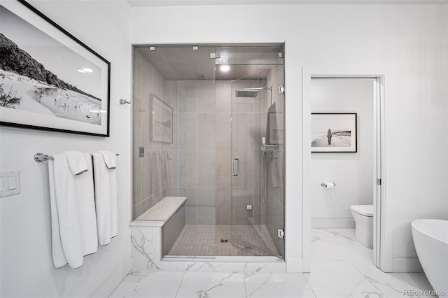 full bathroom with toilet, marble finish floor, baseboards, and a stall shower