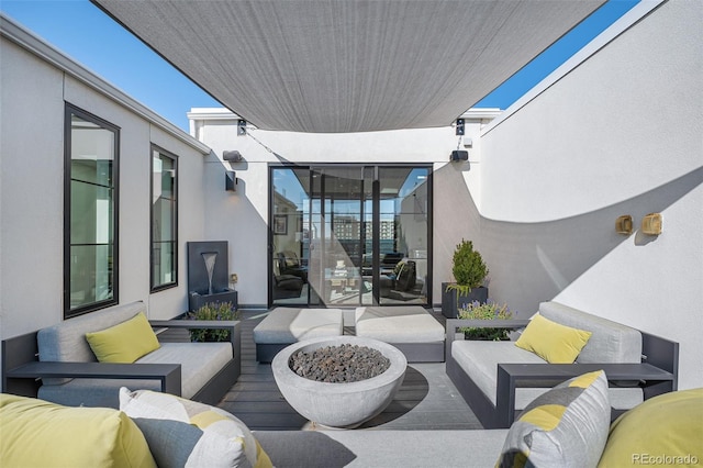 view of patio / terrace featuring an outdoor living space with a fire pit