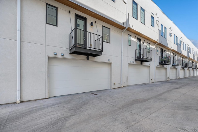 view of property featuring an attached garage and a residential view