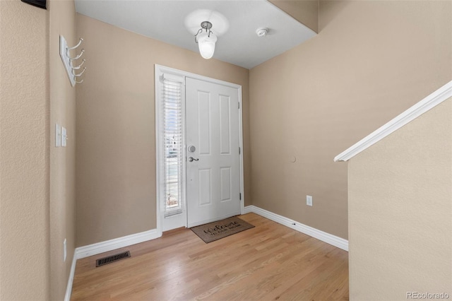 foyer with light hardwood / wood-style floors