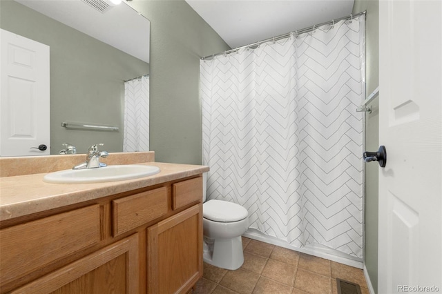 bathroom with toilet, a shower with curtain, vanity, and tile patterned floors