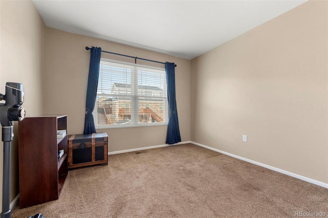 interior space featuring light carpet