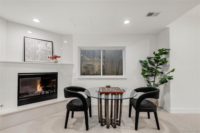 living area with light colored carpet