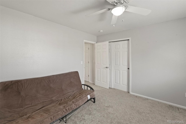 unfurnished room with light colored carpet and ceiling fan