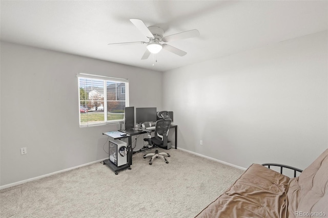 carpeted office with ceiling fan