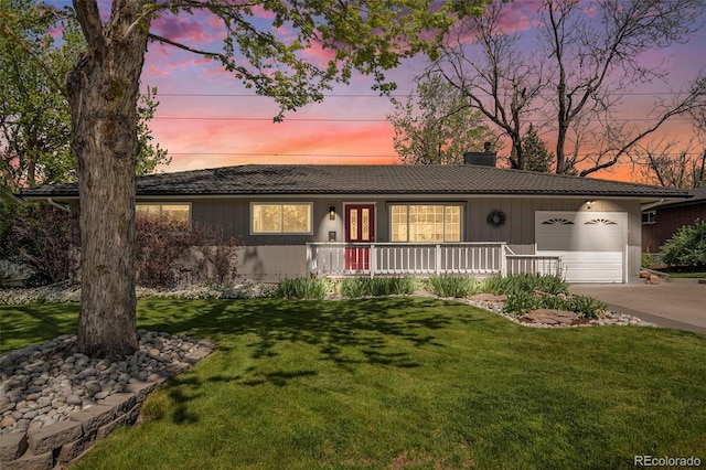6150 S Southwood Dr, Centennial, CO 80121 - ranch-style house featuring a garage, a lawn, driveway, covered porch, and a chimney
