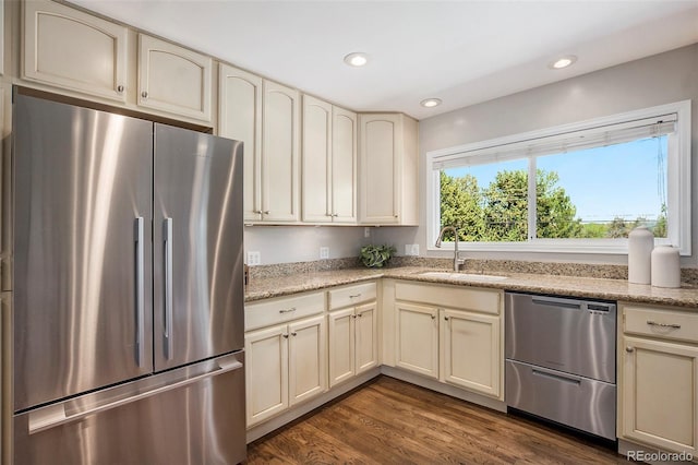 6150 S Southwood Dr, Centennial, CO 80121 - kitchen featuring stainless steel appliances, a sink, cream cabinets, recessed lighting, and dark wood finished floors