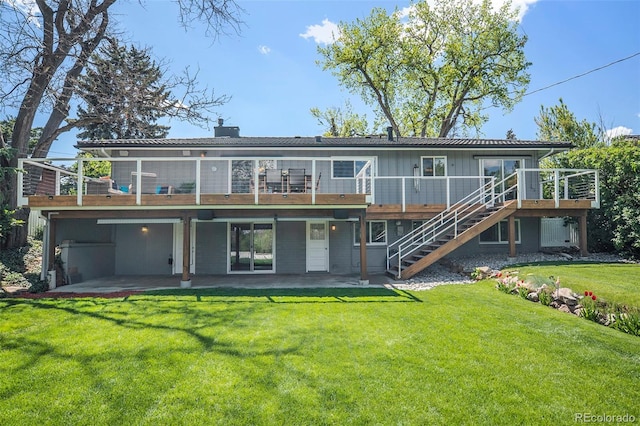 6150 S Southwood Dr, Centennial, CO 80121 - back of house with a patio area, stairs, a wooden deck, and a lawn
