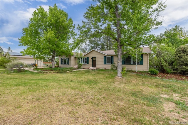 ranch-style house with a front yard and a garage