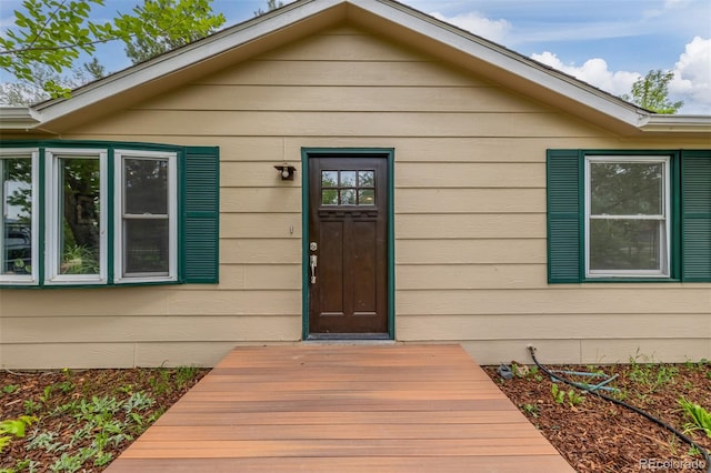 entrance to property with a deck