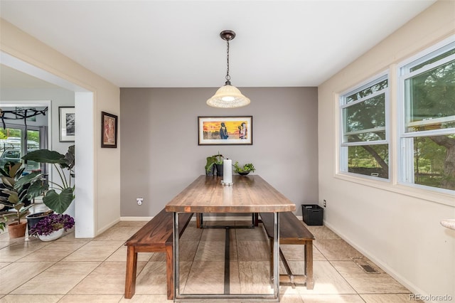 dining area featuring light tile patterned flooring