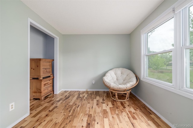 unfurnished room with light hardwood / wood-style flooring