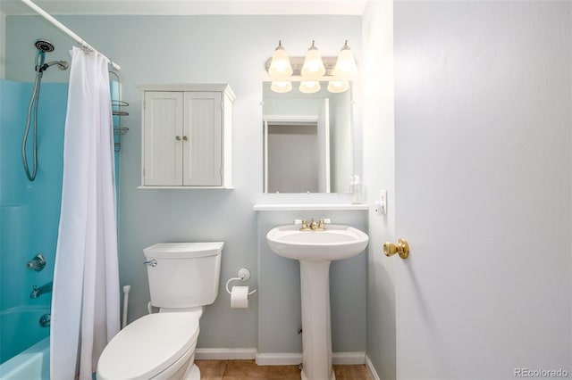 full bathroom featuring shower / tub combo with curtain, sink, tile patterned flooring, and toilet