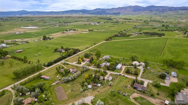 birds eye view of property featuring a rural view and a mountain view