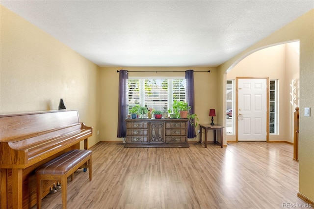 19817 E Prentice Ave, Centennial, CO 80015 - sitting room with arched walkways, light wood-type flooring, and baseboards