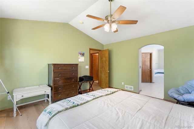 19817 E Prentice Ave, Centennial, CO 80015 - bedroom featuring arched walkways, lofted ceiling, wood finished floors, a ceiling fan, and baseboards