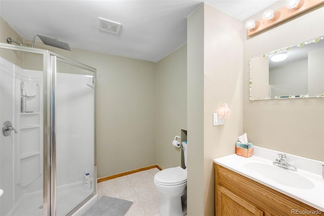 19817 E Prentice Ave, Centennial, CO 80015 - bathroom featuring a shower stall, vanity, toilet, baseboards, and tile patterned floors