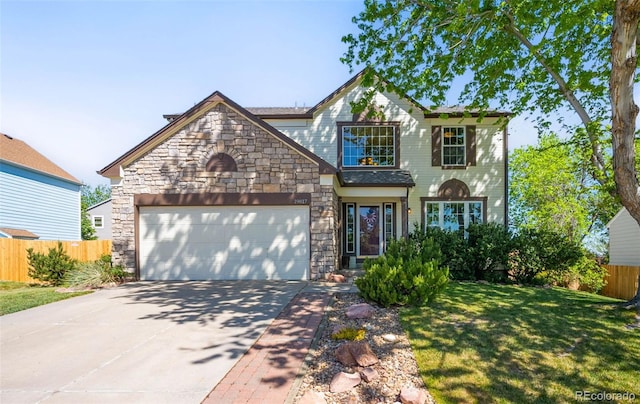 19817 E Prentice Ave, Centennial, CO 80015 - view of front of house featuring stone siding, driveway, and a garage