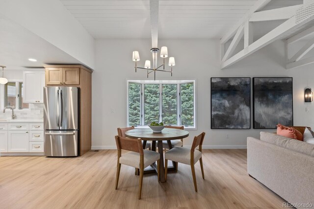 41 Eagle Dr, Littleton, CO 80123 - dining area with light wood-style floors, beam ceiling, baseboards, a chandelier, and recessed lighting
