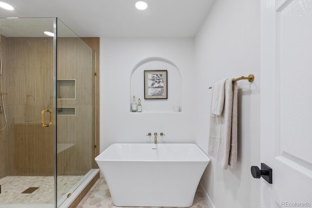 41 Eagle Dr, Littleton, CO 80123 - bathroom with a soaking tub, a stall shower, and recessed lighting