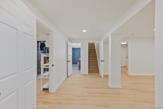 41 Eagle Dr, Littleton, CO 80123 - hall with light wood-style flooring, stairway, baseboards, and recessed lighting