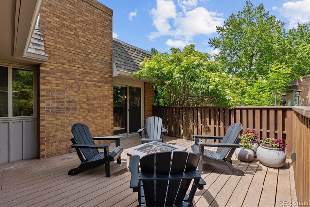 41 Eagle Dr, Littleton, CO 80123 - wooden deck featuring an outdoor fire pit