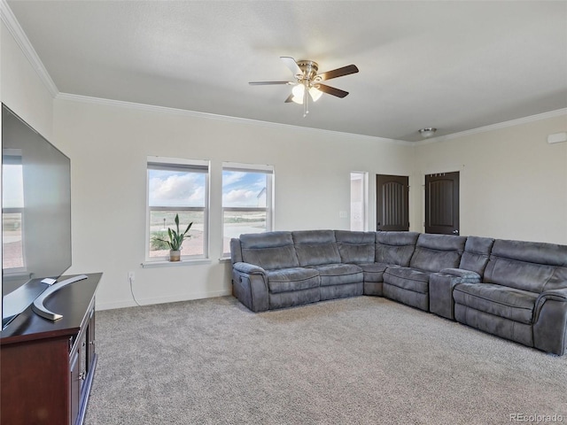 living area featuring ornamental molding, carpet floors, ceiling fan, and baseboards