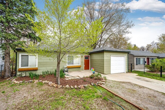 1945 Yosemite St, Denver, CO 80220 - ranch-style house with an attached garage, driveway, and fence