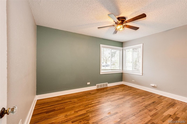 1945 Yosemite St, Denver, CO 80220 - empty room with a ceiling fan, wood finished floors, a textured ceiling, and baseboards