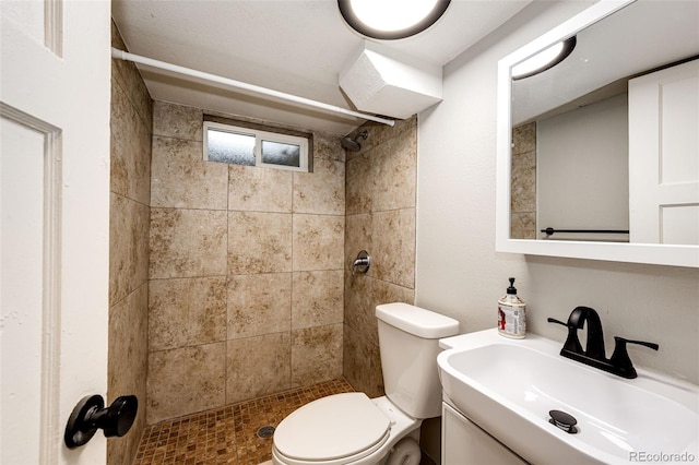 1945 Yosemite St, Denver, CO 80220 - full bathroom featuring a sink, a tile shower, and toilet